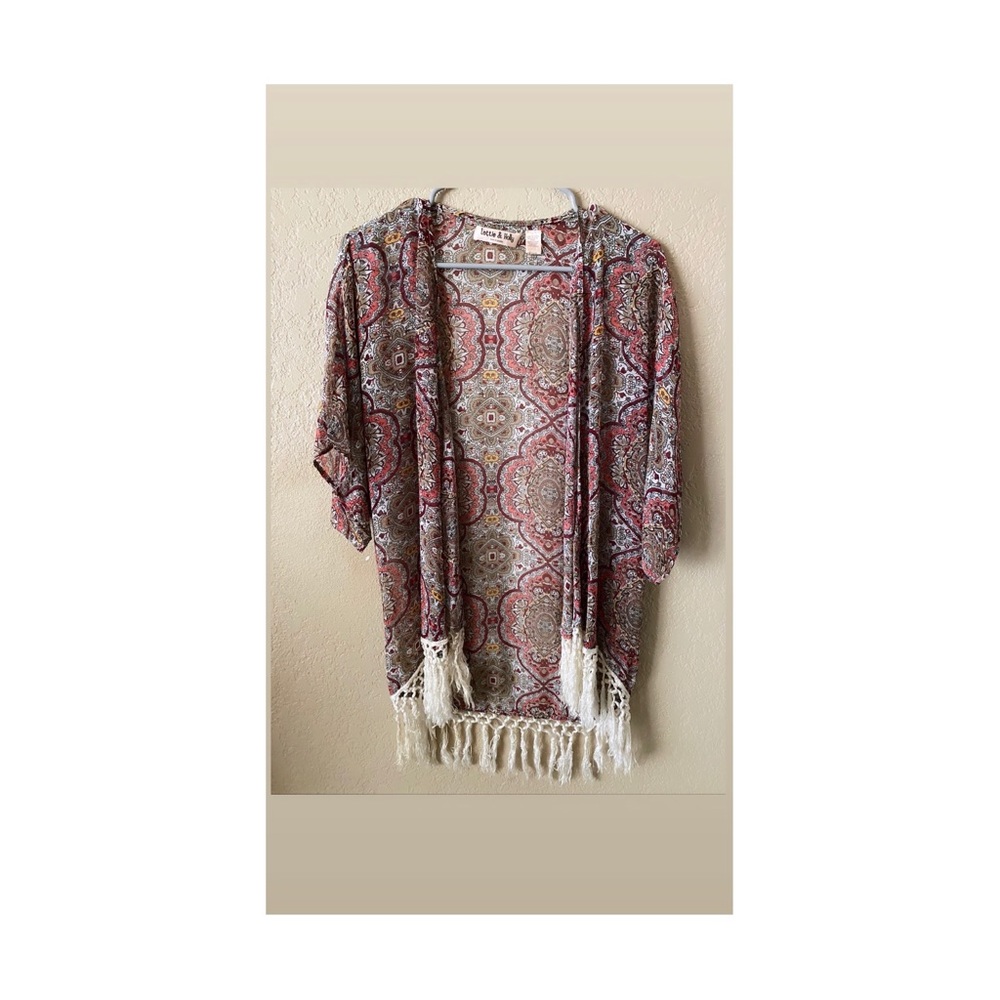 Lottie & Holly shrug